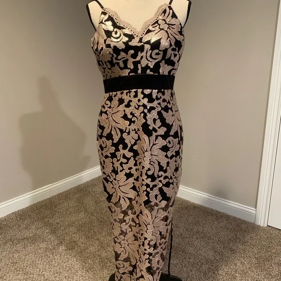 Venus black and gold, maxi dress with sequin detailing all over.